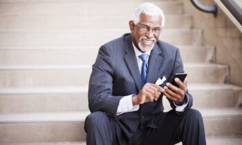 Image Text: Attractive Senior African American Business Man Using Phone